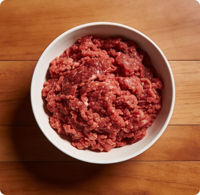 A bowl of raw ground blend on a wooden surface