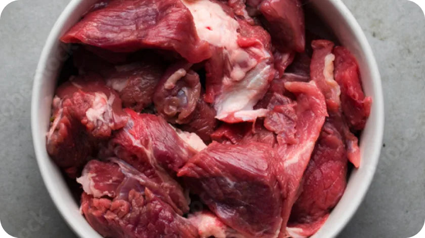 A bowl of raw meat cuts